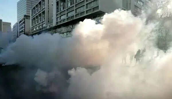 Police fire tear gas at Paris 'Freedom Convoy'; see pics