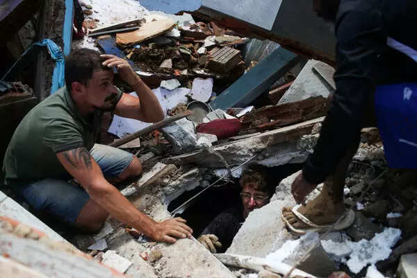 Mudslides leave at least 94 dead in Brazil; see pics
