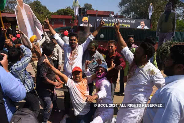 AAP workers celebrate as party sweeps Punjab; see pics