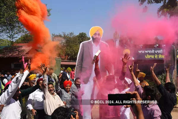 AAP workers celebrate as party sweeps Punjab; see pics