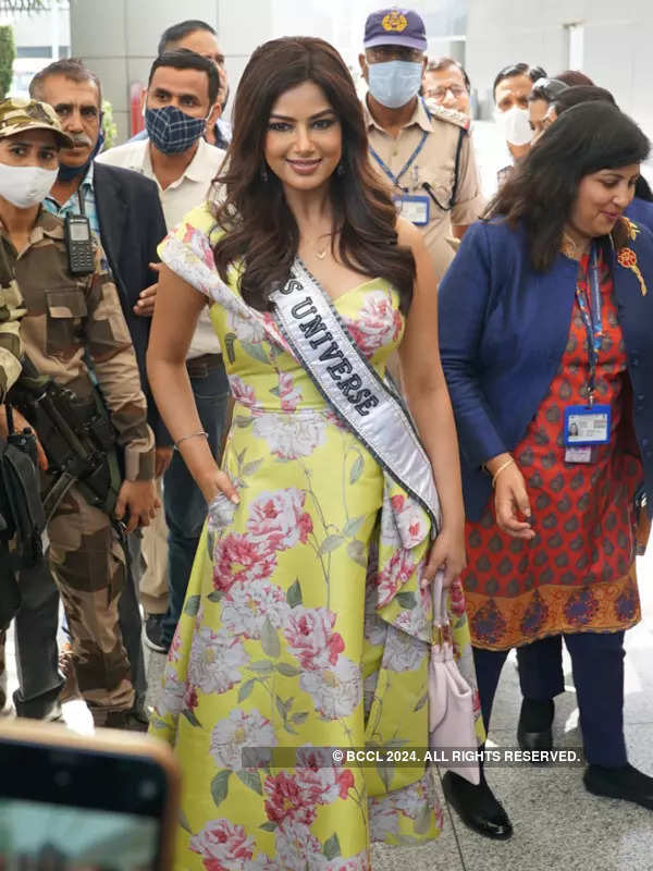 Miss Universe 2021 Harnaaz Kaur Sandhu glows in a yellow midi dress as she receives warm welcome at Delhi airport