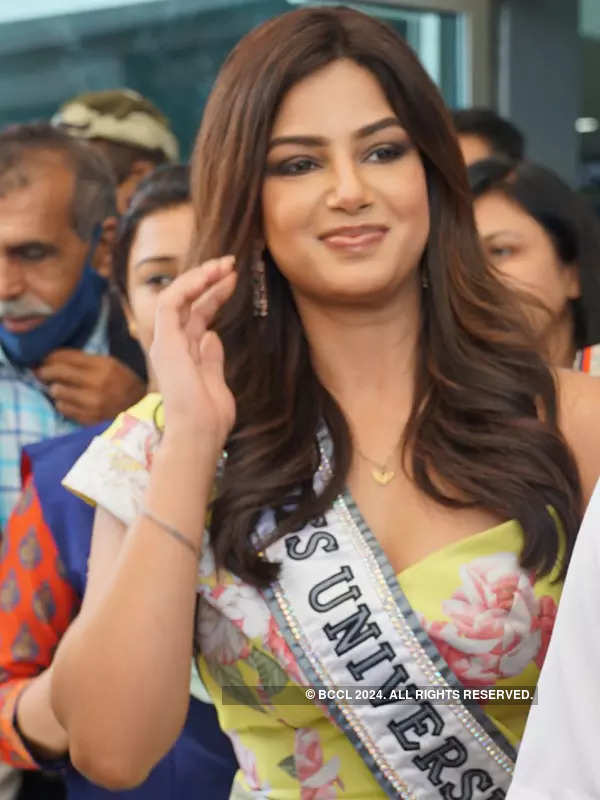 Miss Universe 2021 Harnaaz Kaur Sandhu glows in a yellow midi dress as she receives warm welcome at Delhi airport