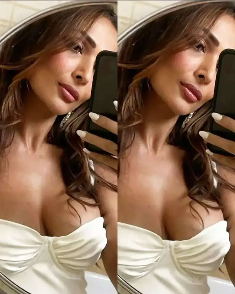 Malaika Arora sets hearts racing with her new mirror selfies in satin slip thigh-high dress
