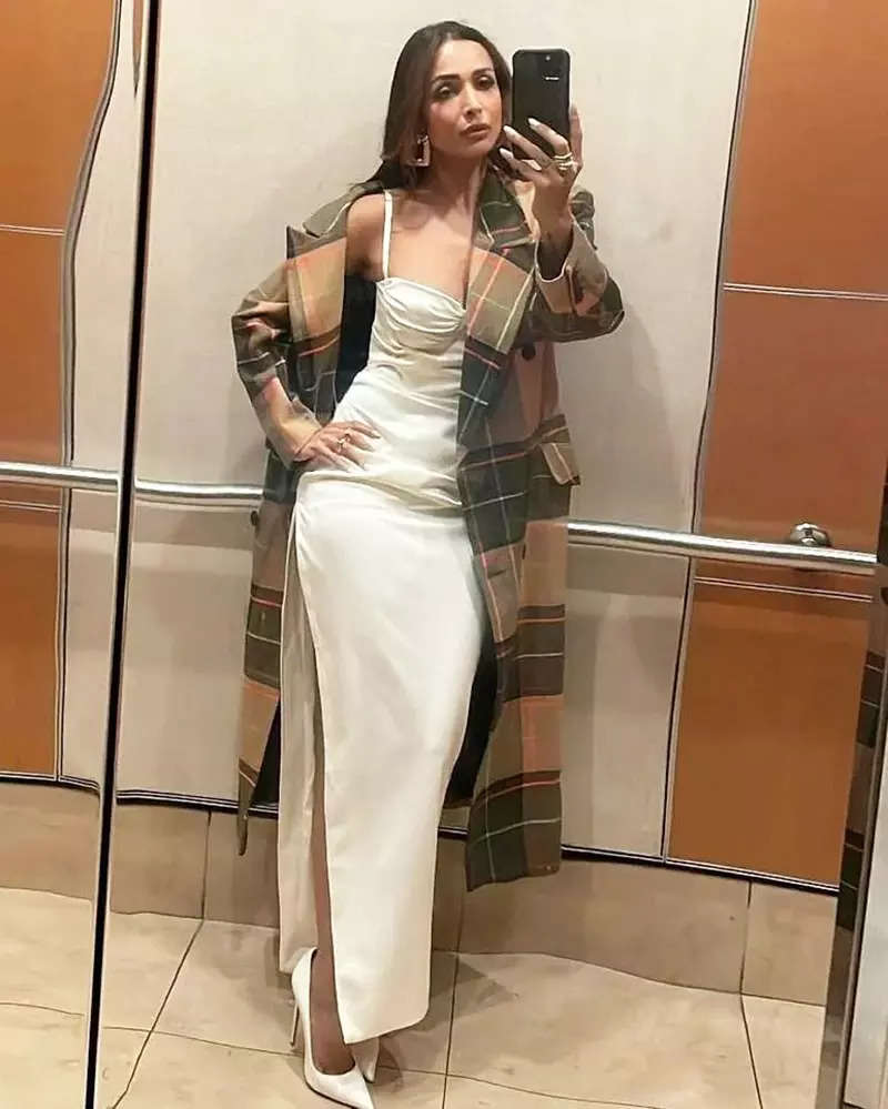 Malaika Arora sets hearts racing with her new mirror selfies in satin slip thigh-high dress
