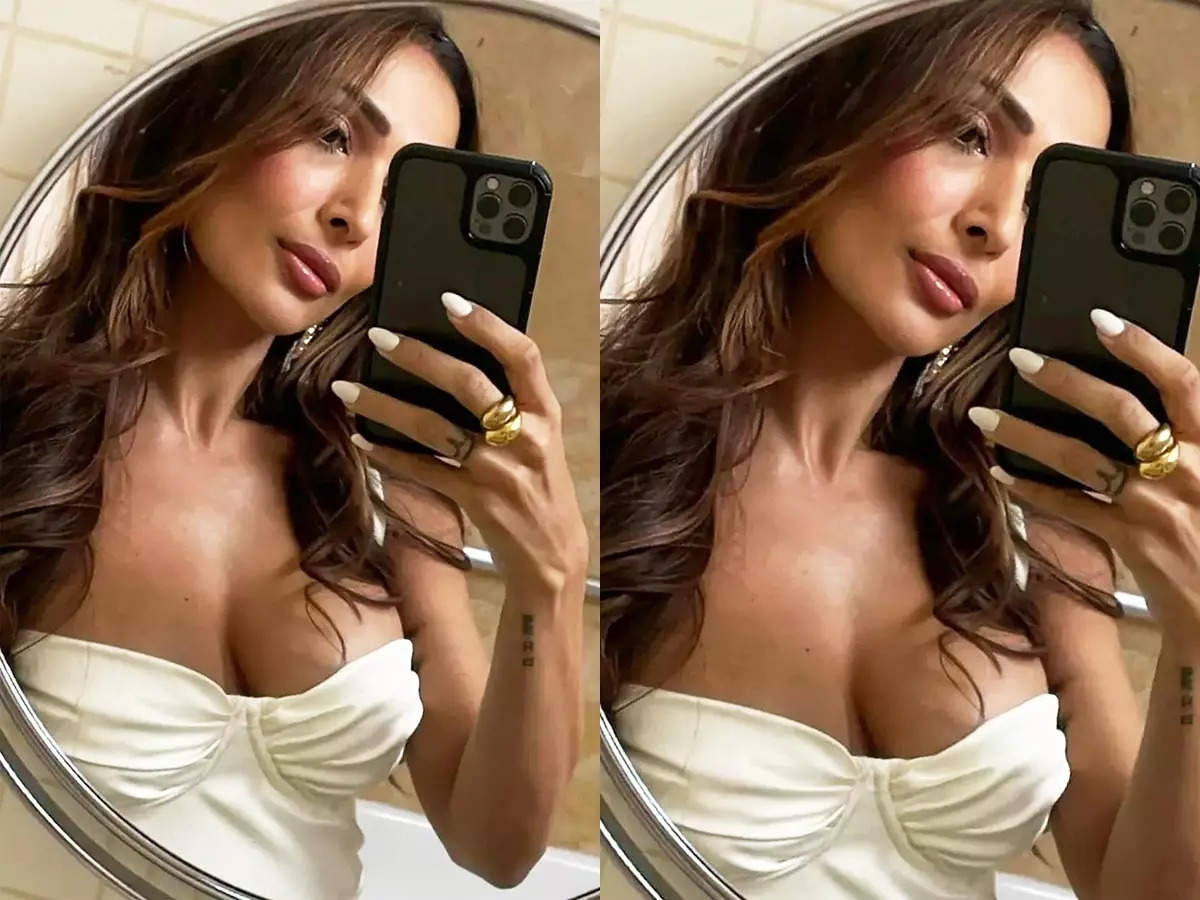 Malaika Arora sets hearts racing with her new mirror selfies in satin slip thigh-high dress