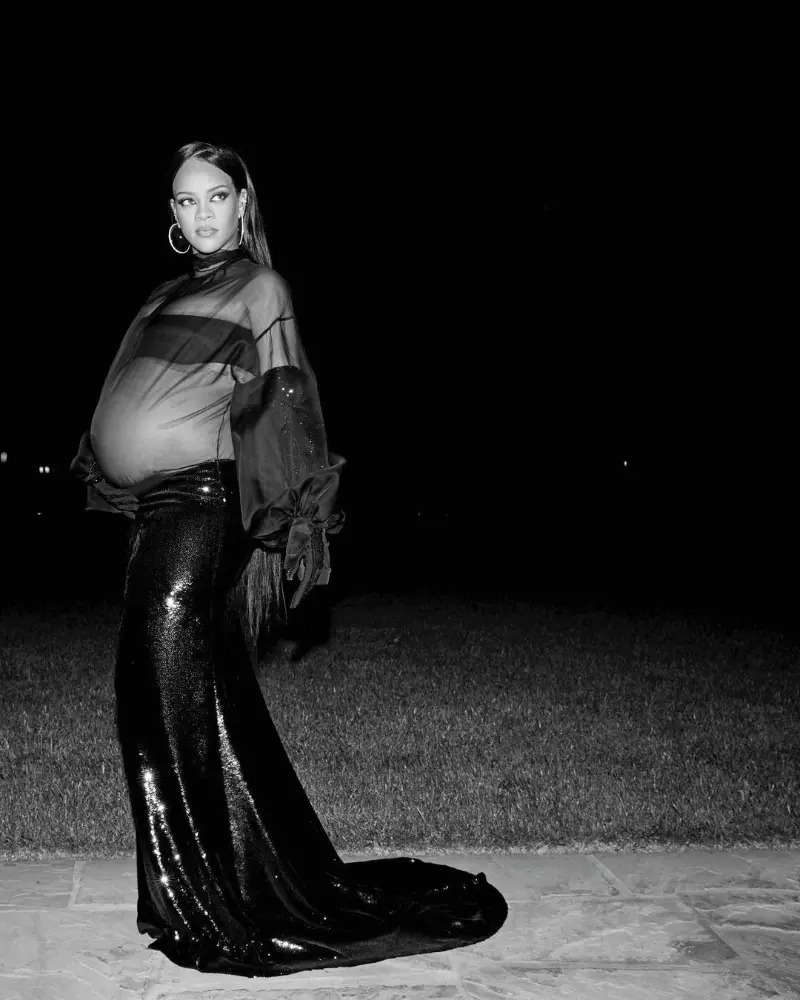 Rihanna flaunts her baby bump in a belly-baring black sheer dress at Beyonce & Jay-Z's party