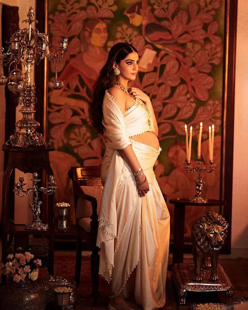 Mom-to-be Sonam Kapoor flaunts her baby bump in these new pictures in an ivory saree