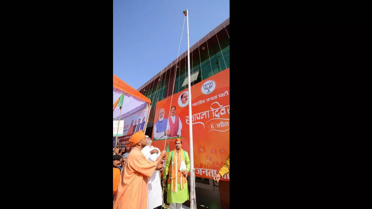 In pics CM Yogi hoists party flag on BJP's 42nd foundation day