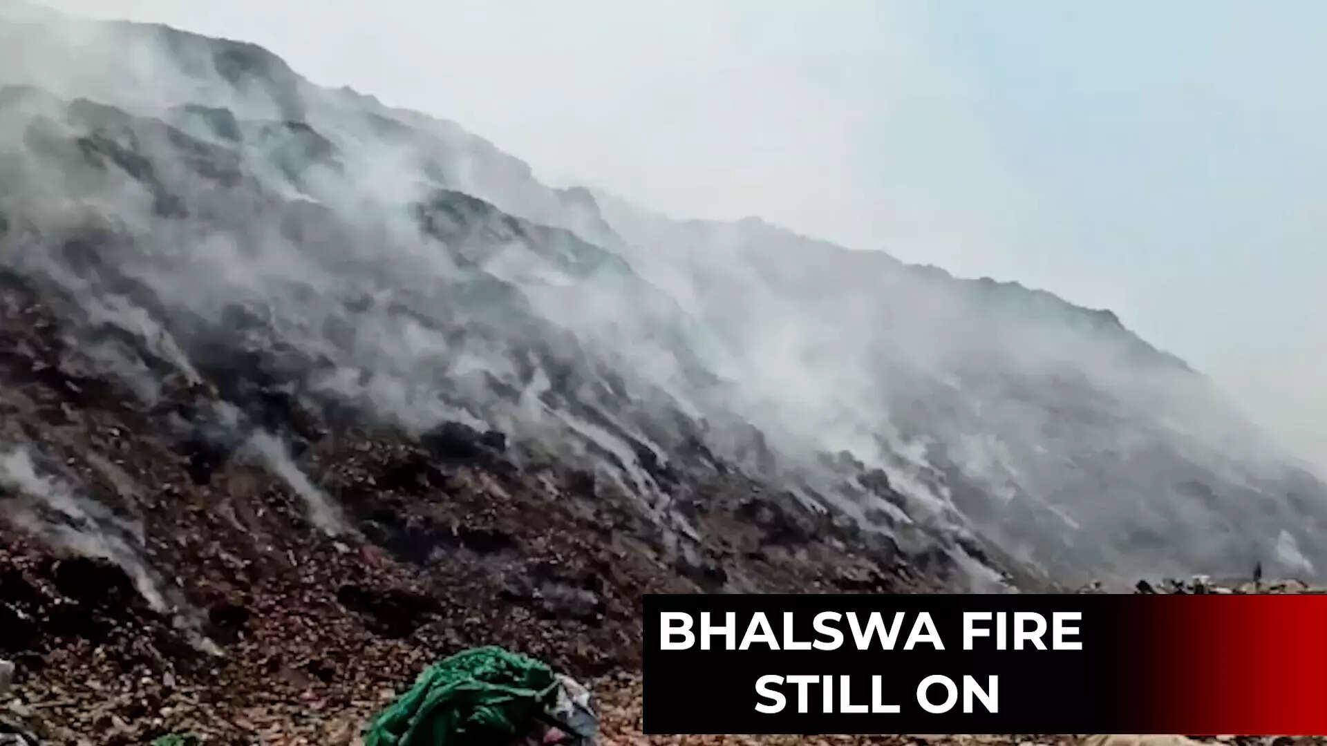 Delhi: Fire fighting operations continue at Bhalswa landfill site for ...