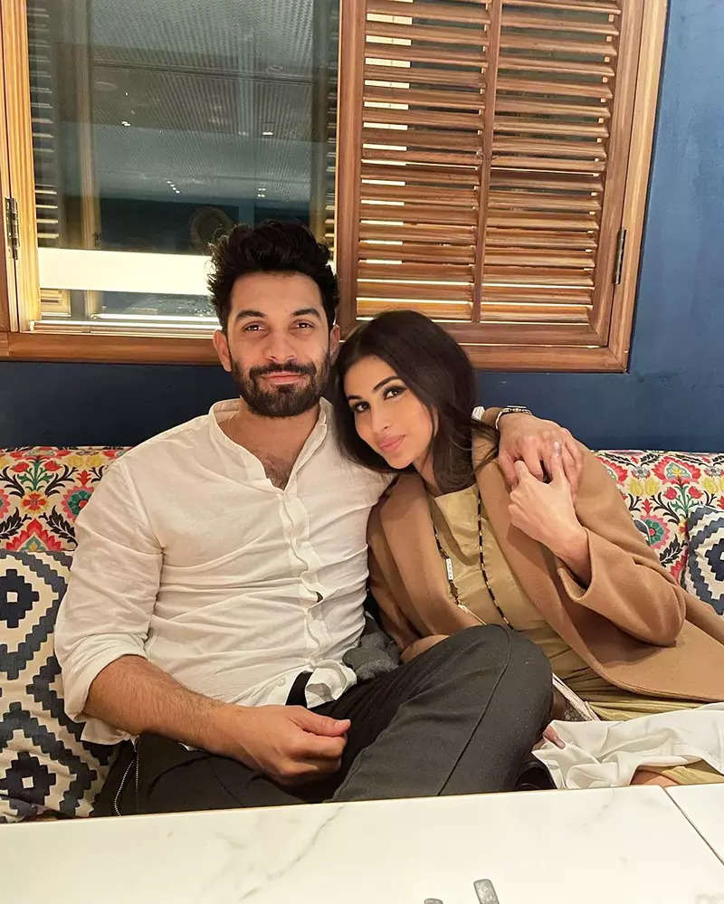 Mouni Roy turns heads in a mini dress, twins in white with hubby in these happy pictures from Doha