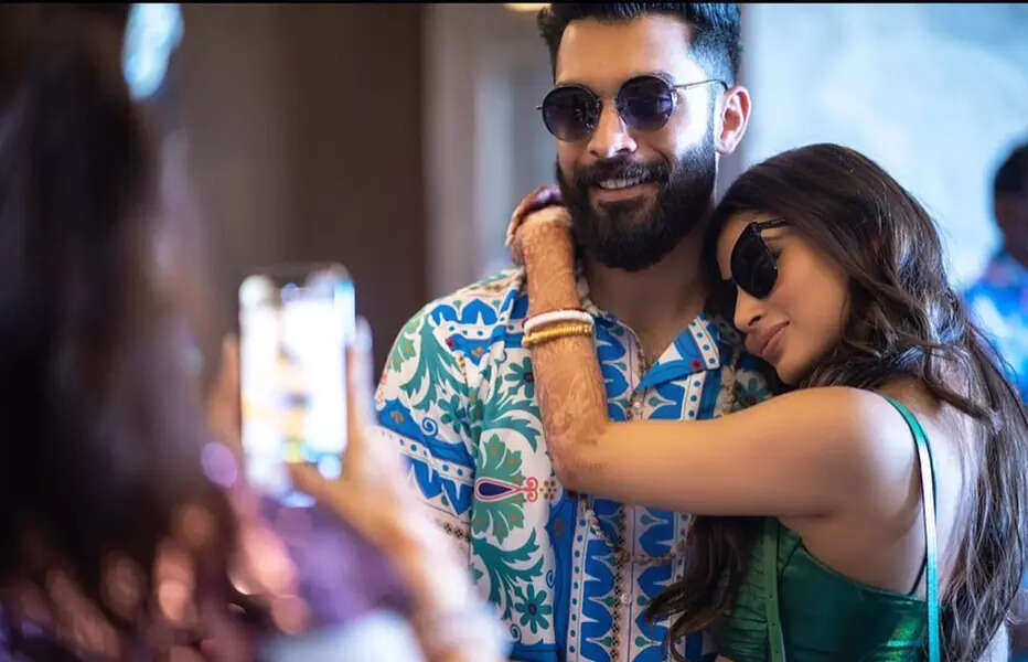 Mouni Roy turns heads in a mini dress, twins in white with hubby in these happy pictures from Doha