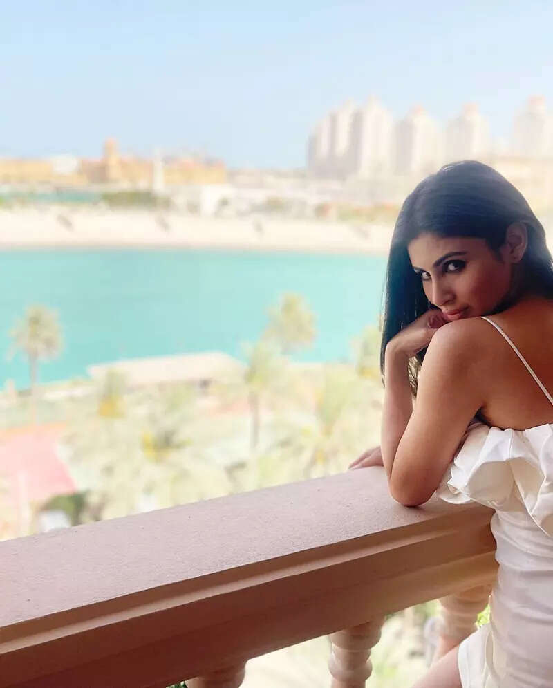 Mouni Roy turns heads in a mini dress, twins in white with hubby in these happy pictures from Doha