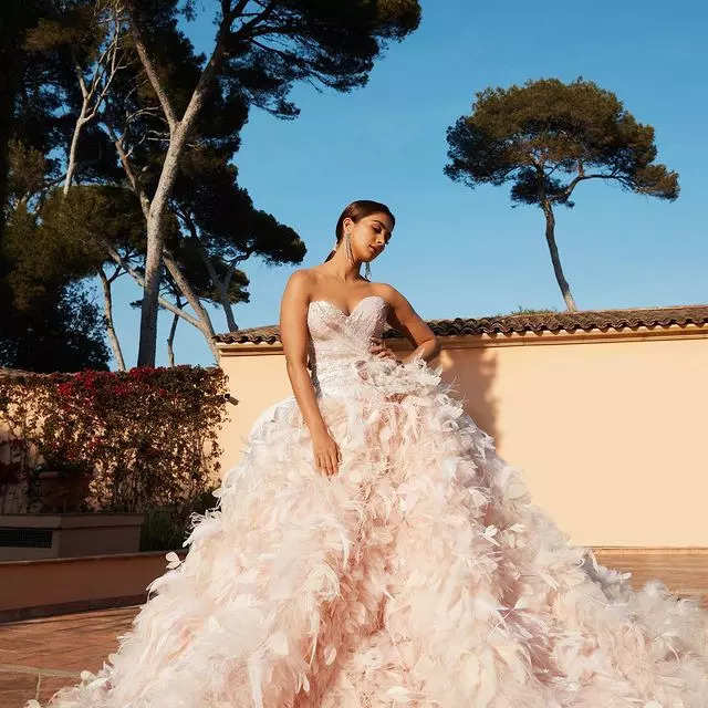 Cannes 2022: Pooja Hegde makes a stunning red carpet debut in a dreamy feathered gown at Top Gun: Maverick premiere - Times of India