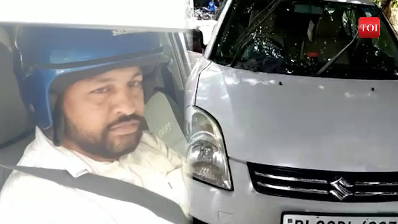 Strange Man gets challan for not wearing a helmet in a car