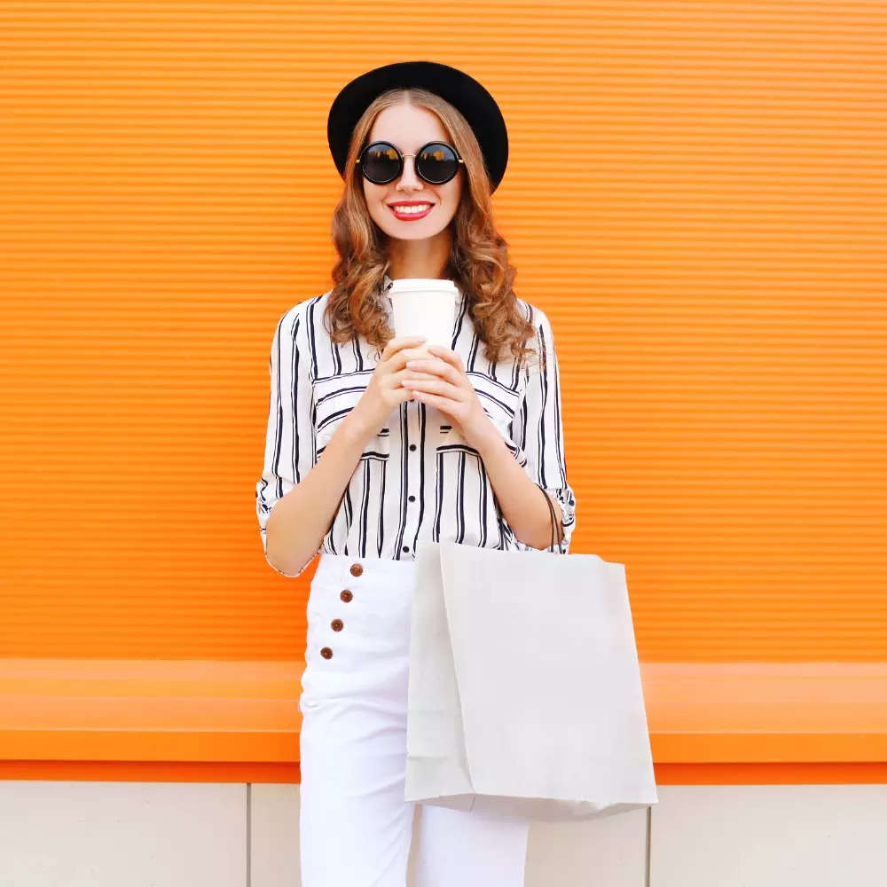 fashion-pretty-young-smiling-woman-model-shopping-bag-coffee-cup-picture-id615594364