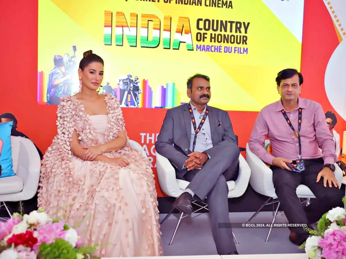 Nargis Fakhri with L Murugan, Union Minister of State for Information and Ravinder Bhaker, MD NFDC​​