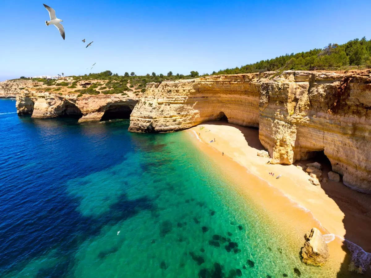 Heaven is hiding right here at this skylit cave in Portugal with a beach!