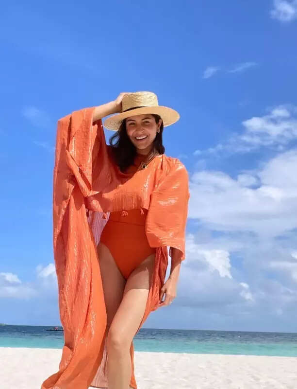 Anushka Sharma makes summer more colourful in orange swimsuit, see beachy snaps