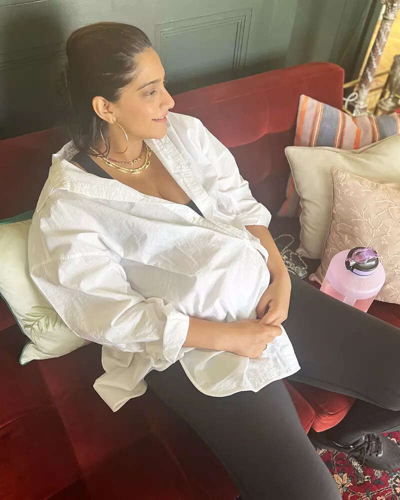 Soon-to-be mommy Sonam Kapoor flaunts her baby bump in an oversized white shirt in these new pictures