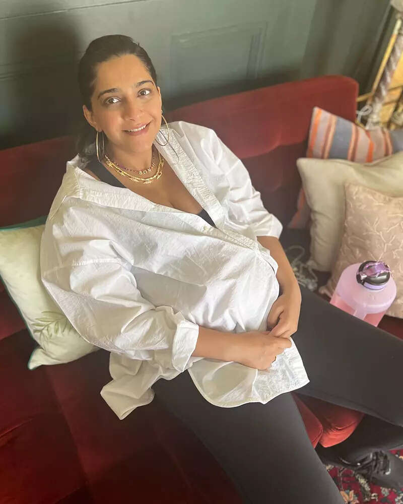 Soon-to-be mommy Sonam Kapoor flaunts her baby bump in an oversized white shirt in these new pictures