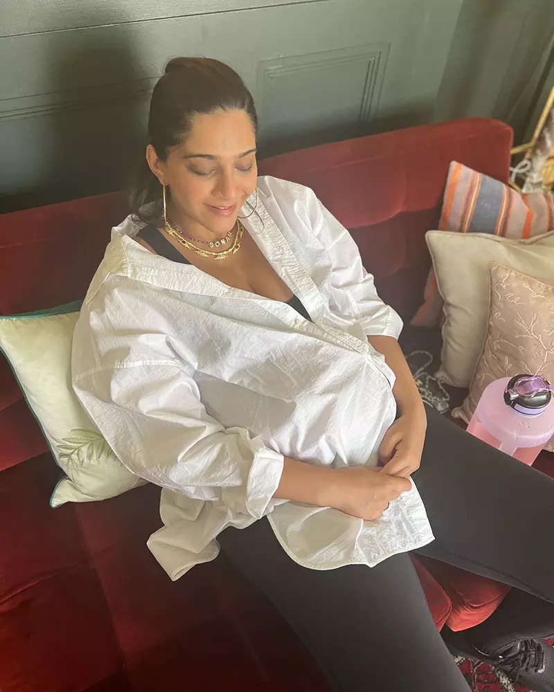 Soon-to-be mommy Sonam Kapoor flaunts her baby bump in an oversized white shirt in these new pictures