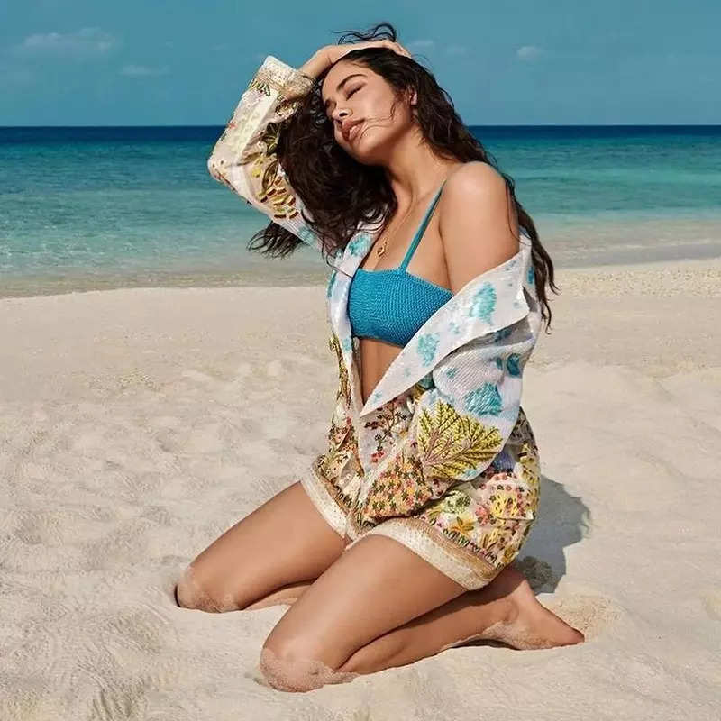 Janhvi Kapoor flaunts her toned midriff in a blue slit dress in these captivating pictures