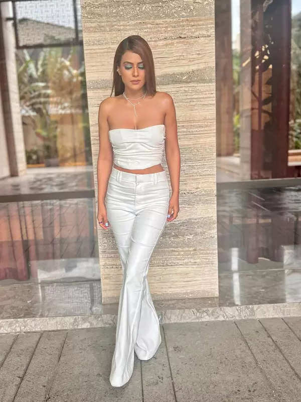 Nia Sharma raises temperature in white crop top and trousers