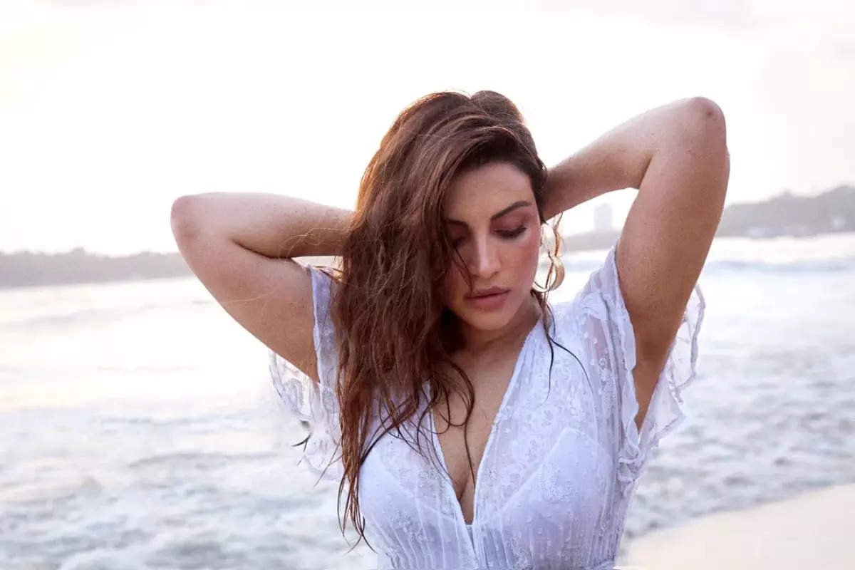 Shama Sikander raises the temperature in an orange monokini as she holidays in style!