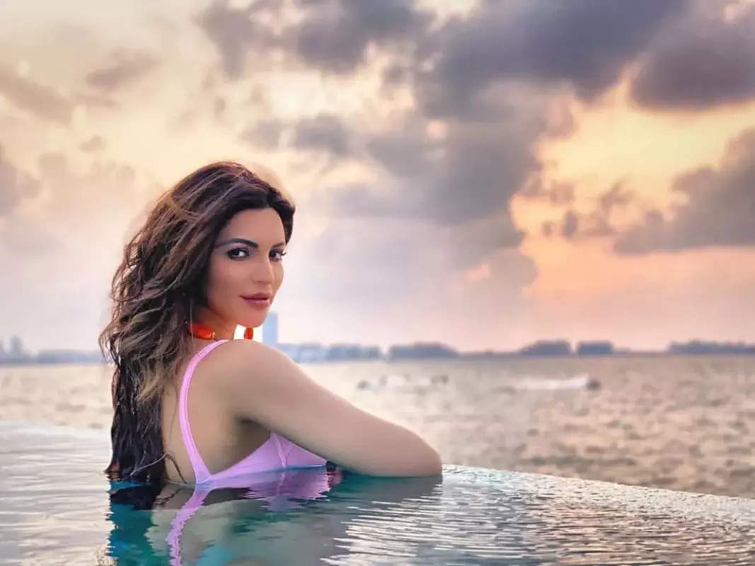 Shama Sikander raises the temperature in an orange monokini as she holidays in style!