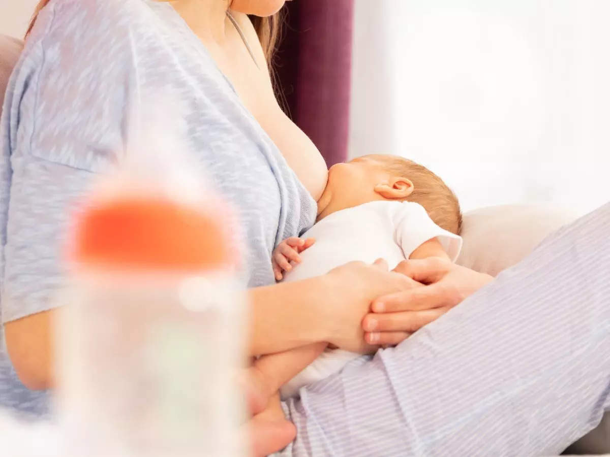 Mum who has boobs so big she can't breastfeed her child for fear