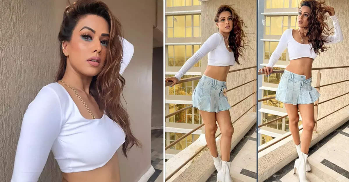 Nia Sharma raises temperature in white crop top and micro mini blue unbuttoned skirt