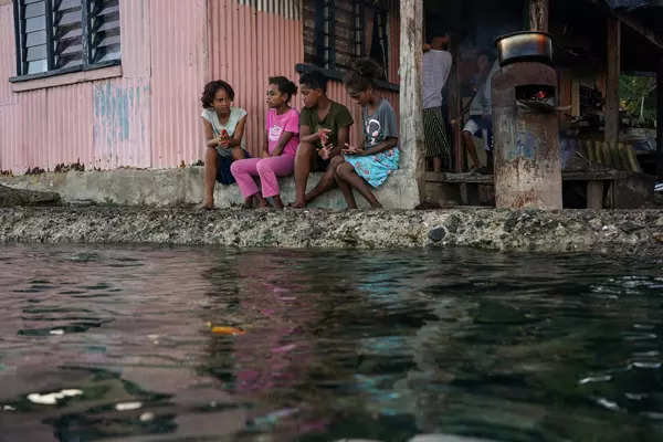 Rising sea levels force Fiji's villagers to relocate; see pics