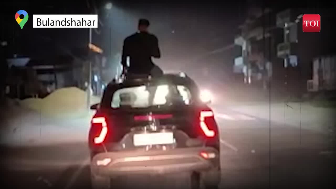 Watch: Video of Drunk man sitting on the roof of running car