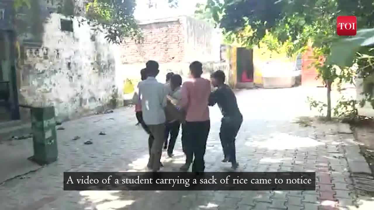 Viral video of students made to carry the bag of 50kg rice by a school ...