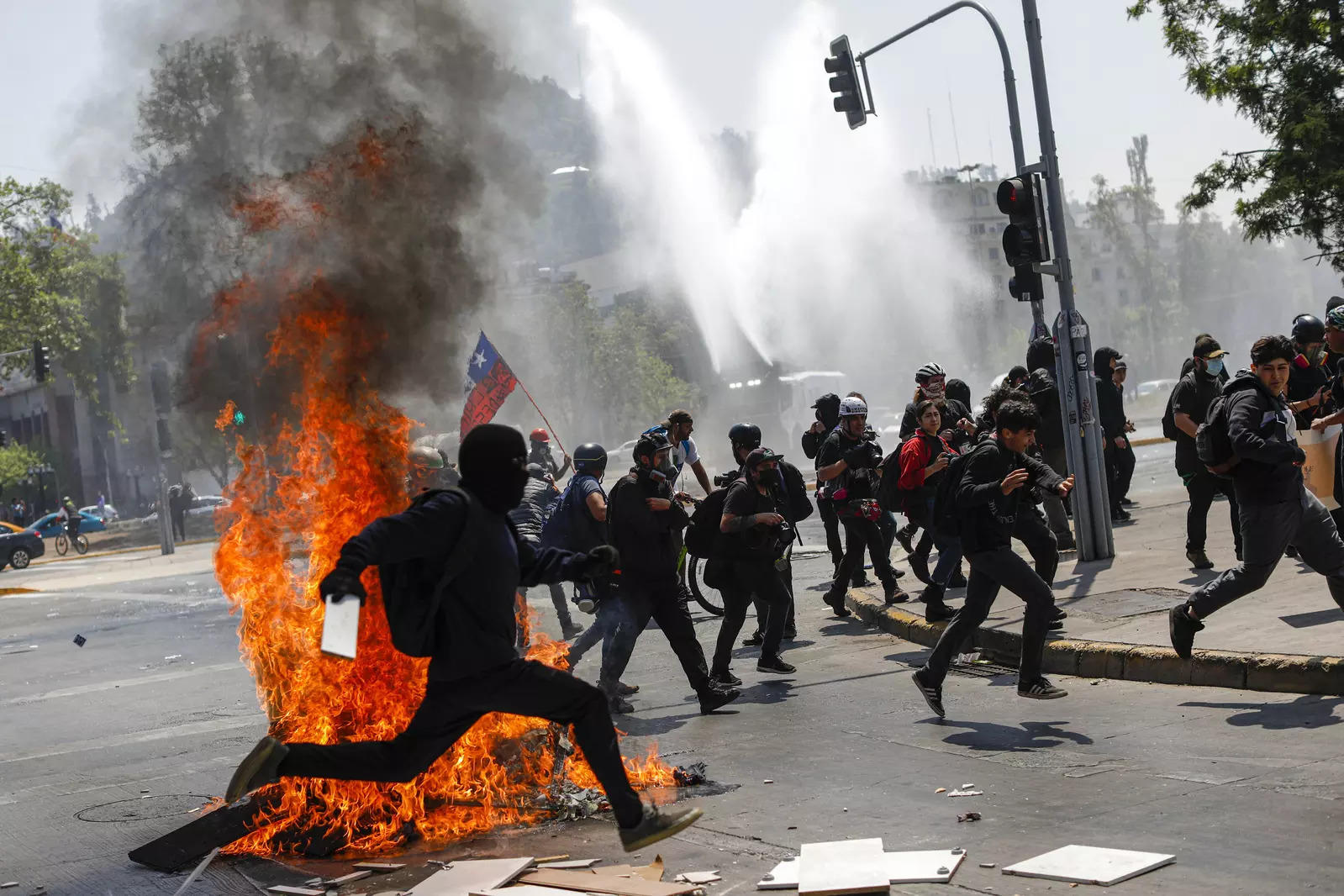 Clashes break out as Chileans mark 3rd anniversary of upheaval; see pics 