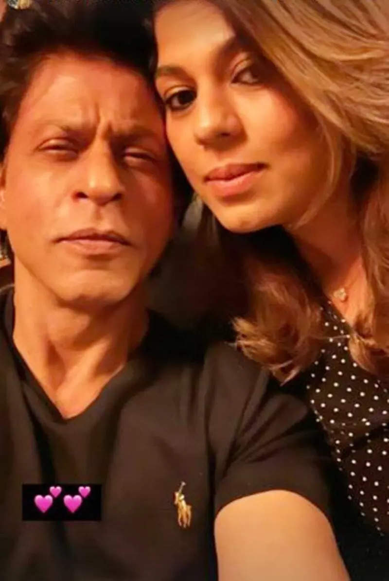 Shah Rukh Khan poses with manager Pooja Dadlani as they celebrate their birthdays together