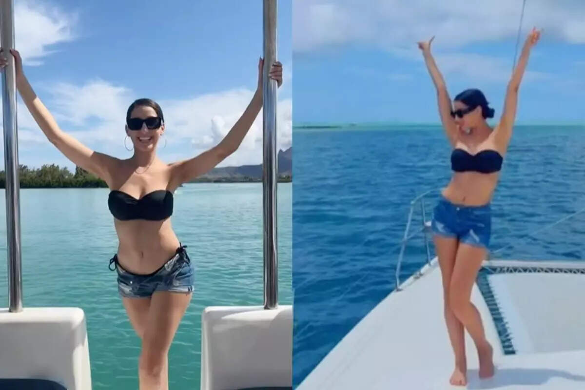 Nora Fatehi turns up the heat with her beach vacation pictures in a strapless black bralette