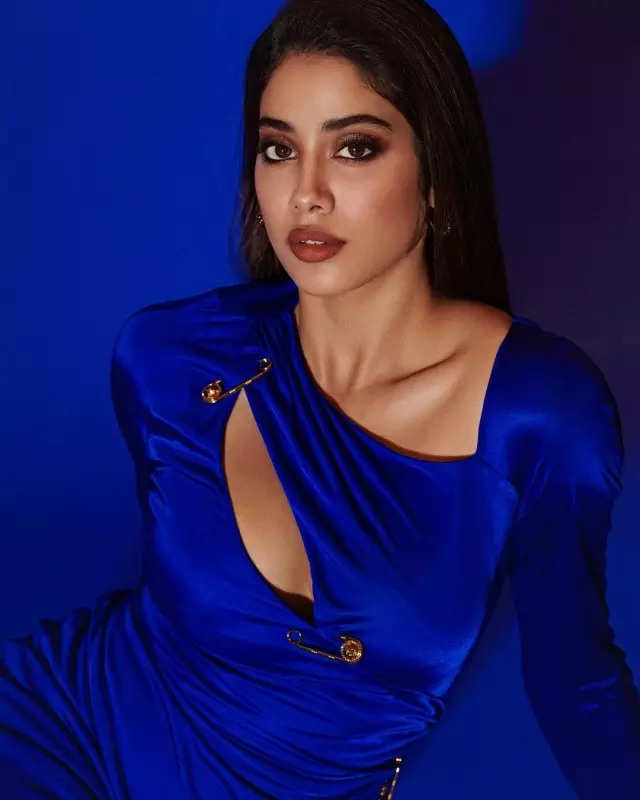 <BR> is a glam goddess in a royal blue thigh-high slit gown, see pictures