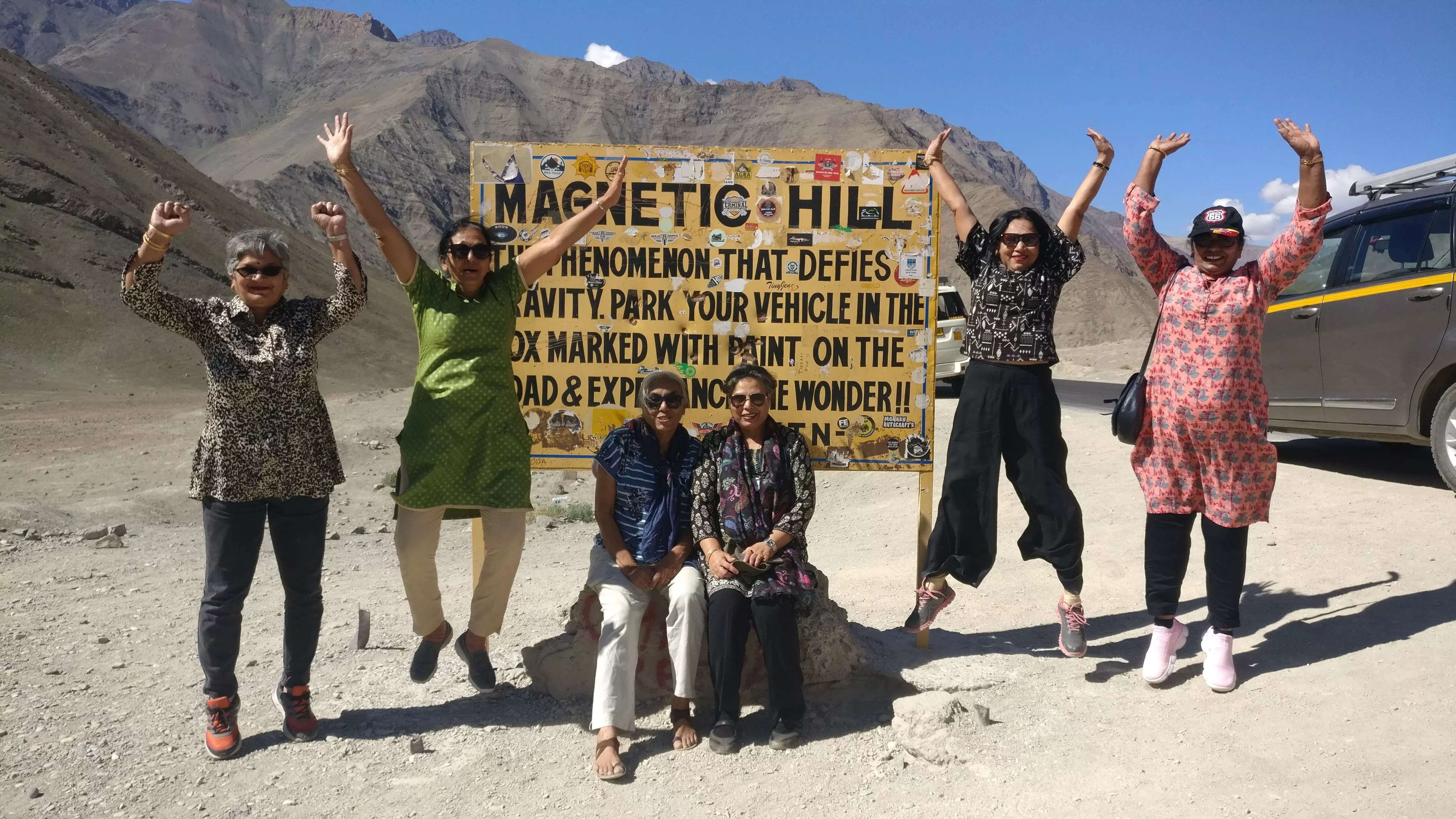 people rejoice on reaching the Magnetic hill in Ladakh