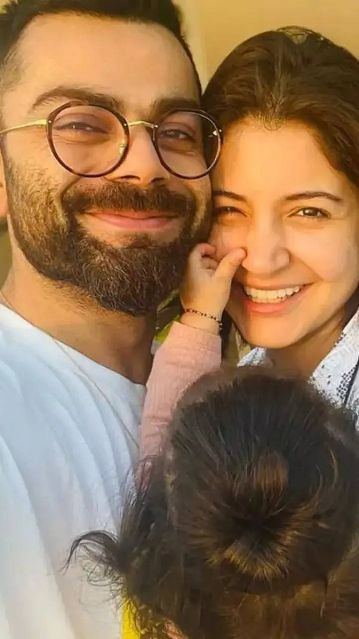 Virat Kohli kisses Anushka Sharma in adorable photo as daughter