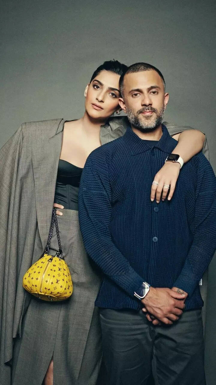 Sonam Kapoor puts an elegant twist to boardroom fashion as she poses with Anand Ahuja