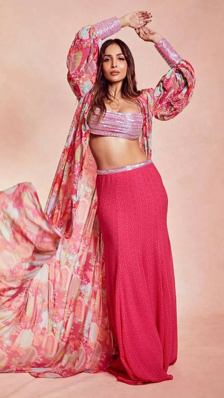 Malaika Arora oozes oomph in pink bralette, skirt and cape jacket
