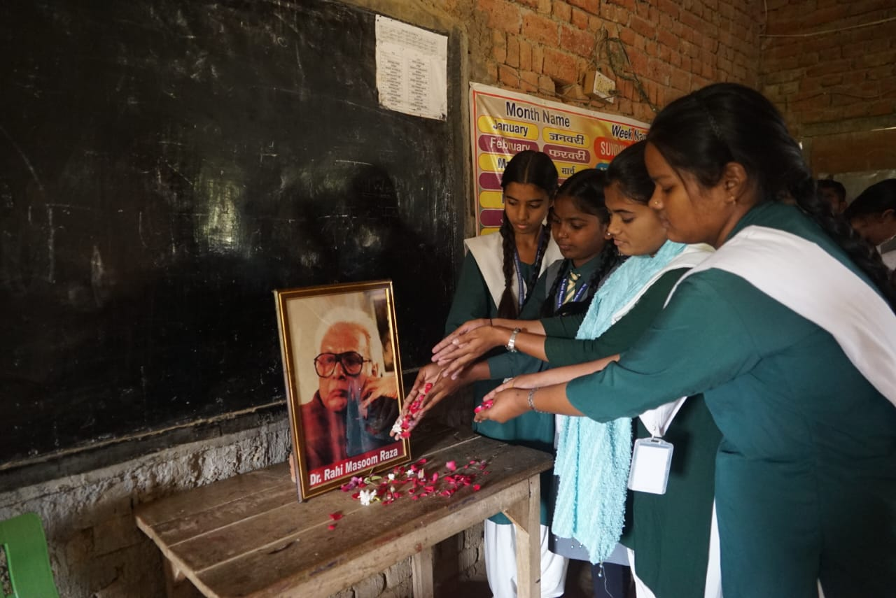 Students at rahi masoom raza memorial convent school paying floral tributes to him