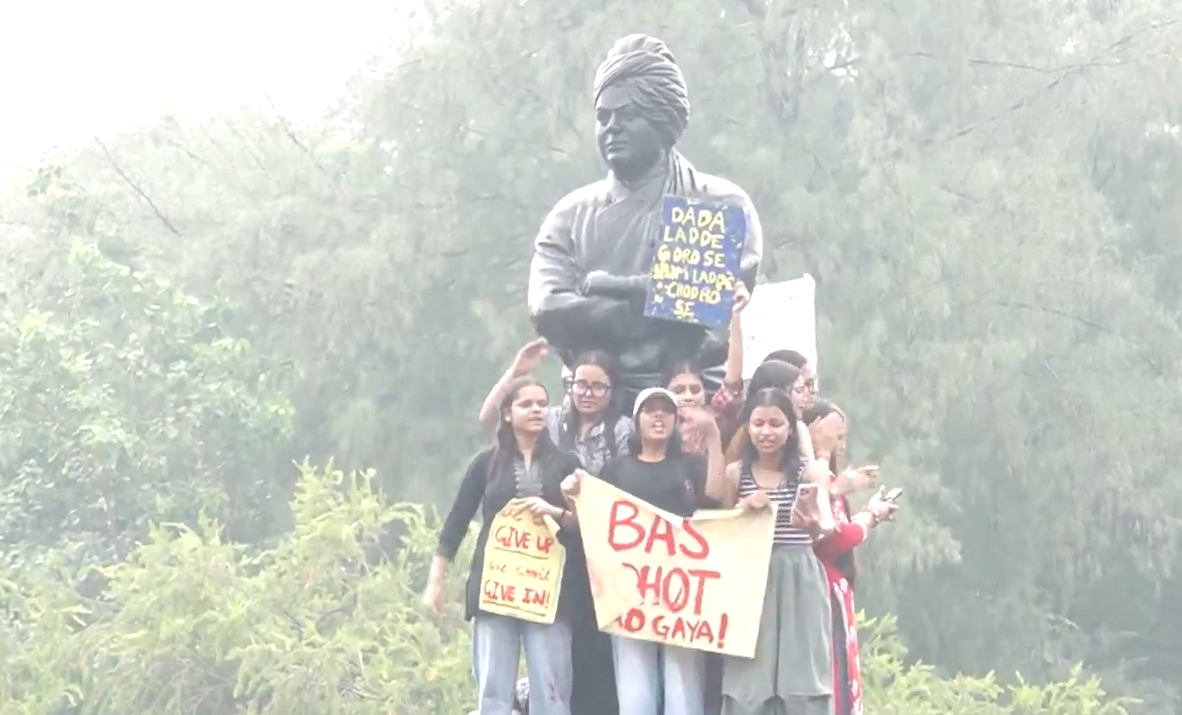 Delhi University students take out protest march amid rains to Miranda House college in north campus over women safety after Kalkaji gang rape.