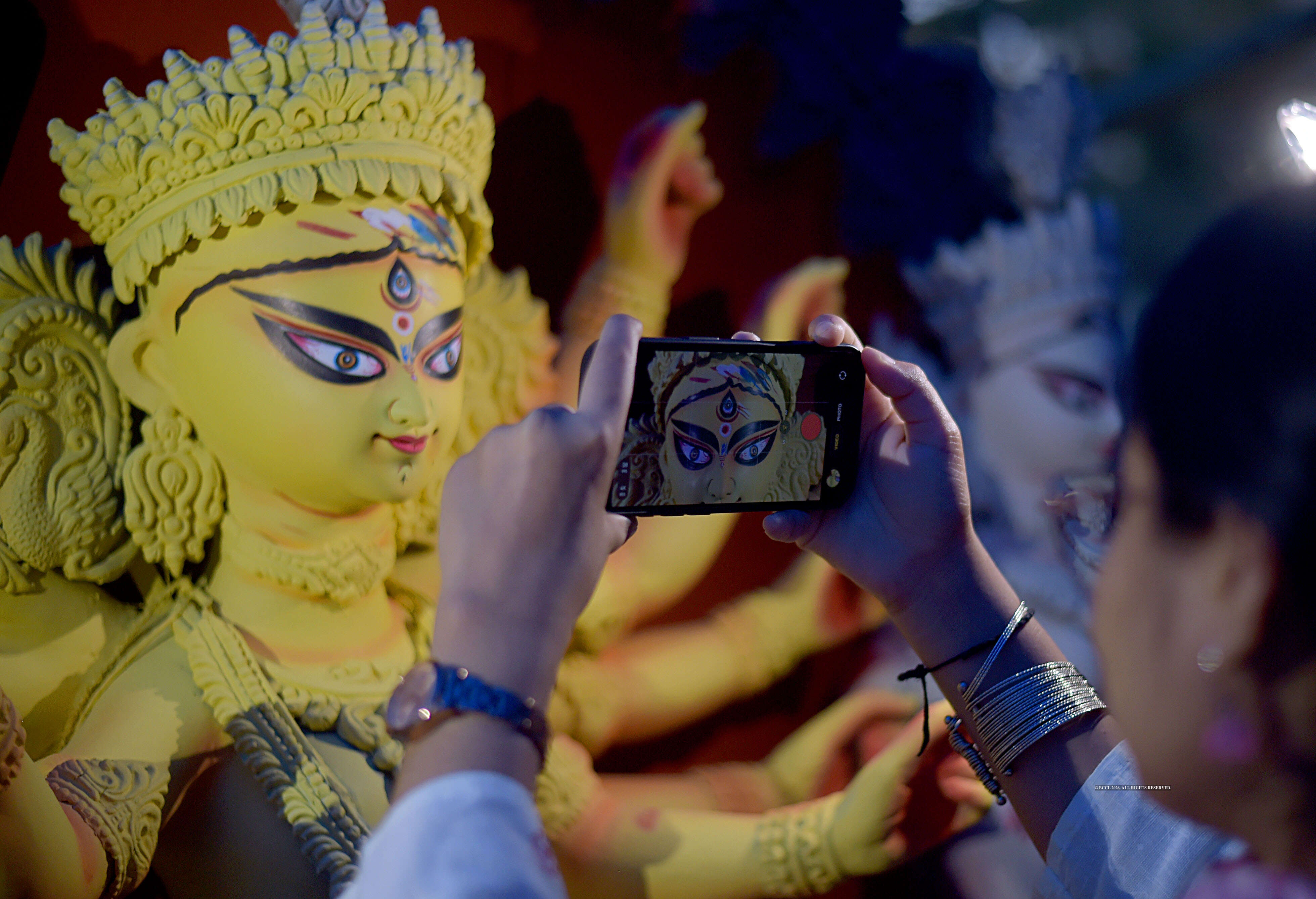 Participants capture the beauty of the pratimas that have already been painted