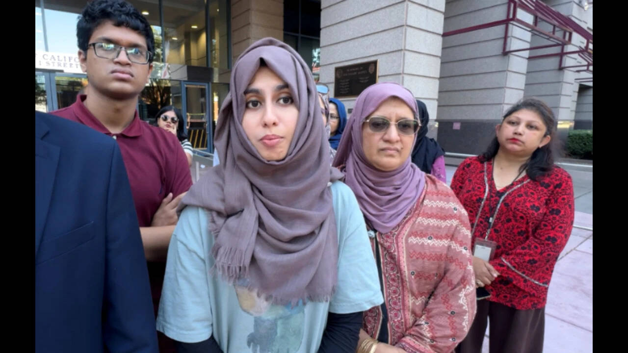 Irfan's sister at Pao Alto City Hall, demanding an investigation into her brother's death.