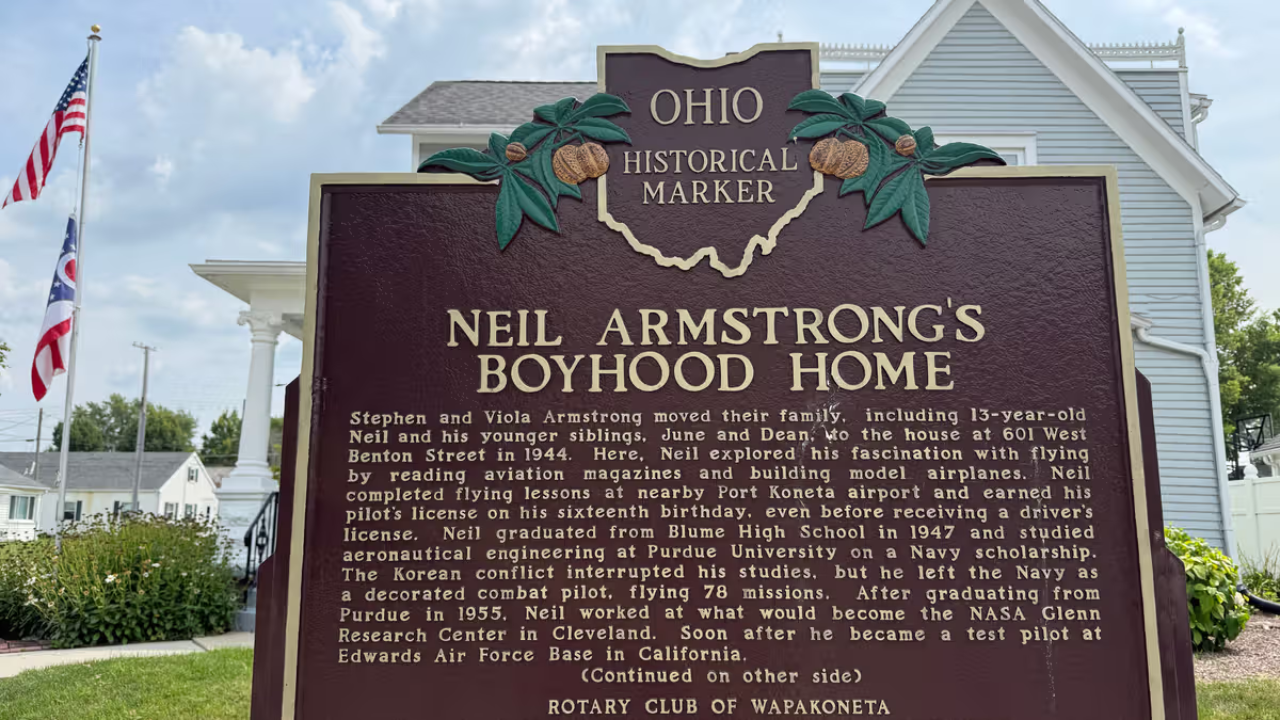 An Ohio historical landmark sign is displayed outside the former home of Neil Armstrong Friday, July 31, 2026, in Wapakoneta, Ohio. (AP Photo/Patrick Aftoora-Orsagos)