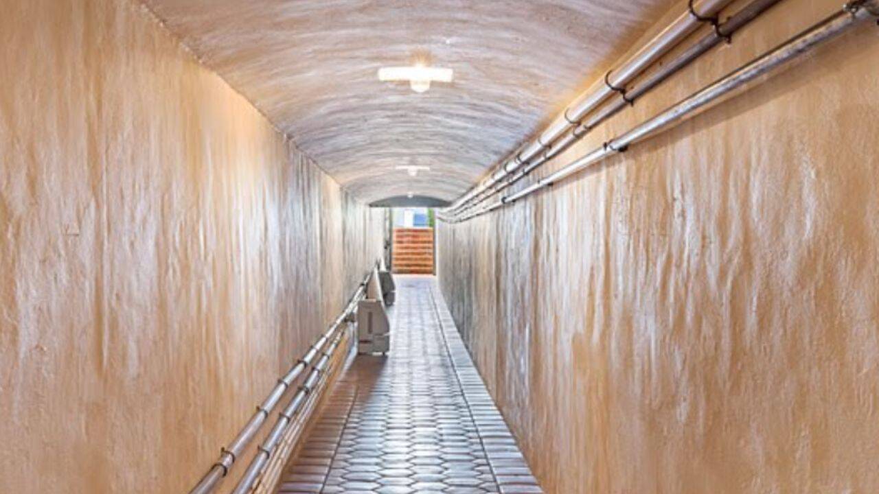 The tunnel ends at the property's private oceanfront cabana.