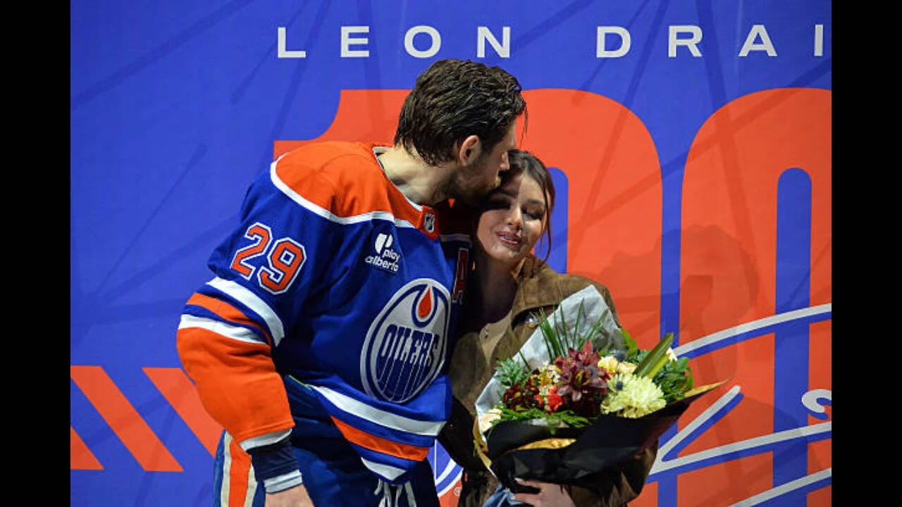 NHL-Leon Draisaitl #29 of the Edmonton Oilers kisses his spouse Celeste Desjardins during Draisaitl's 1000th NHL point ceremony prior to the game against the Los Angeles Kings at Rogers Place on January 10, 2026, in Edmonton, Alberta, Canada