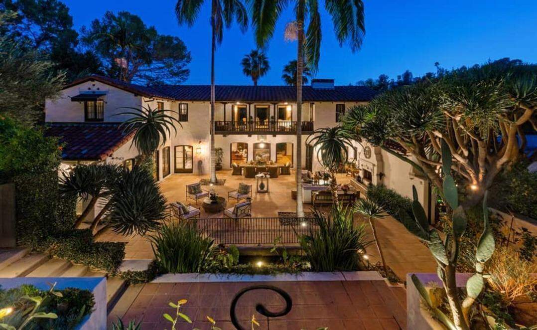 Tim Curry’s former Los Feliz home sits on 1.45 acres of lush grounds, featuring gardens, a pool, koi pond, spa and scenic Downtown Los Angeles views.